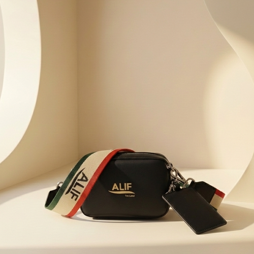 Black Downtown sling with colorful strap and 'ALIF' branding on a white surface.