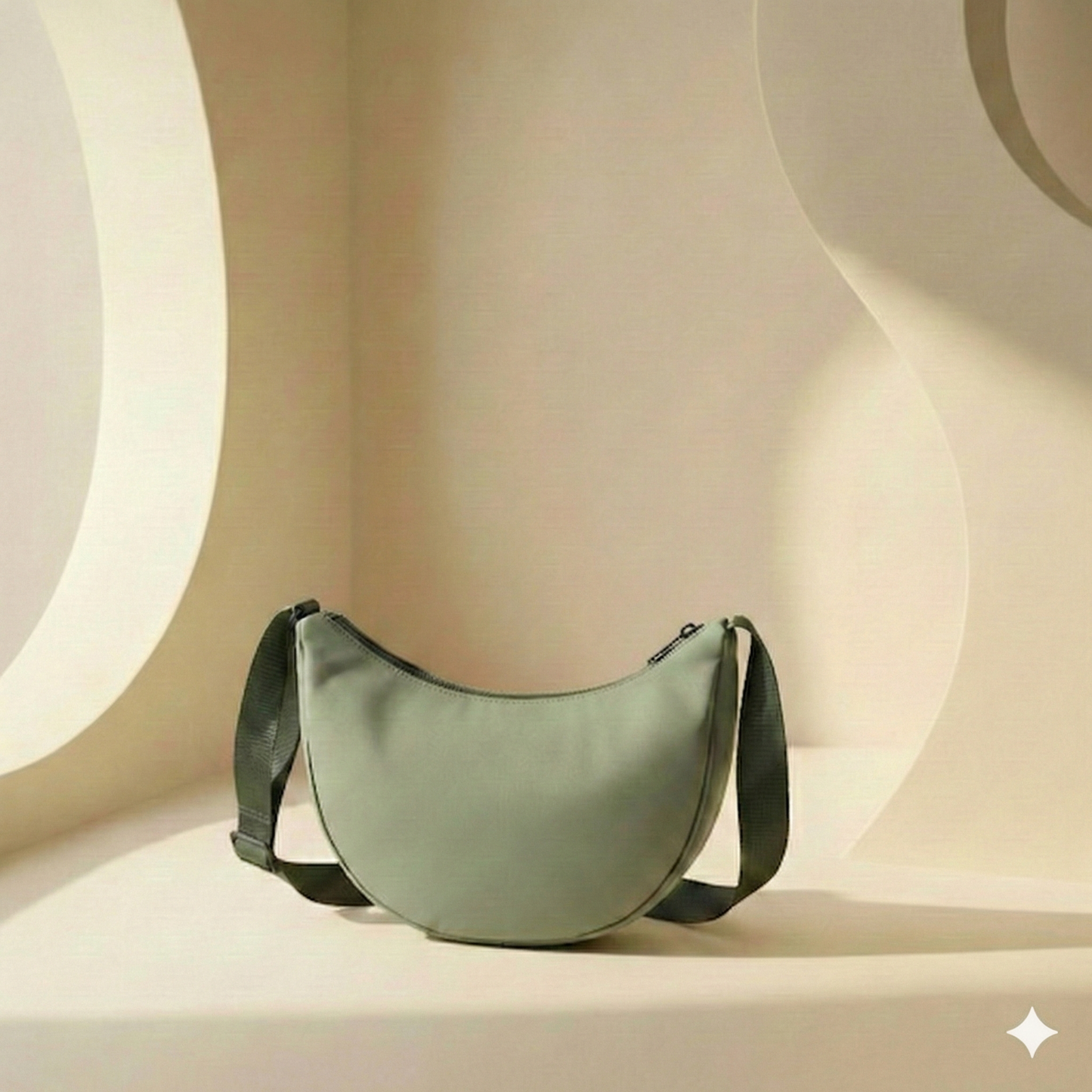 Green half moon shoulder bag on a beige background