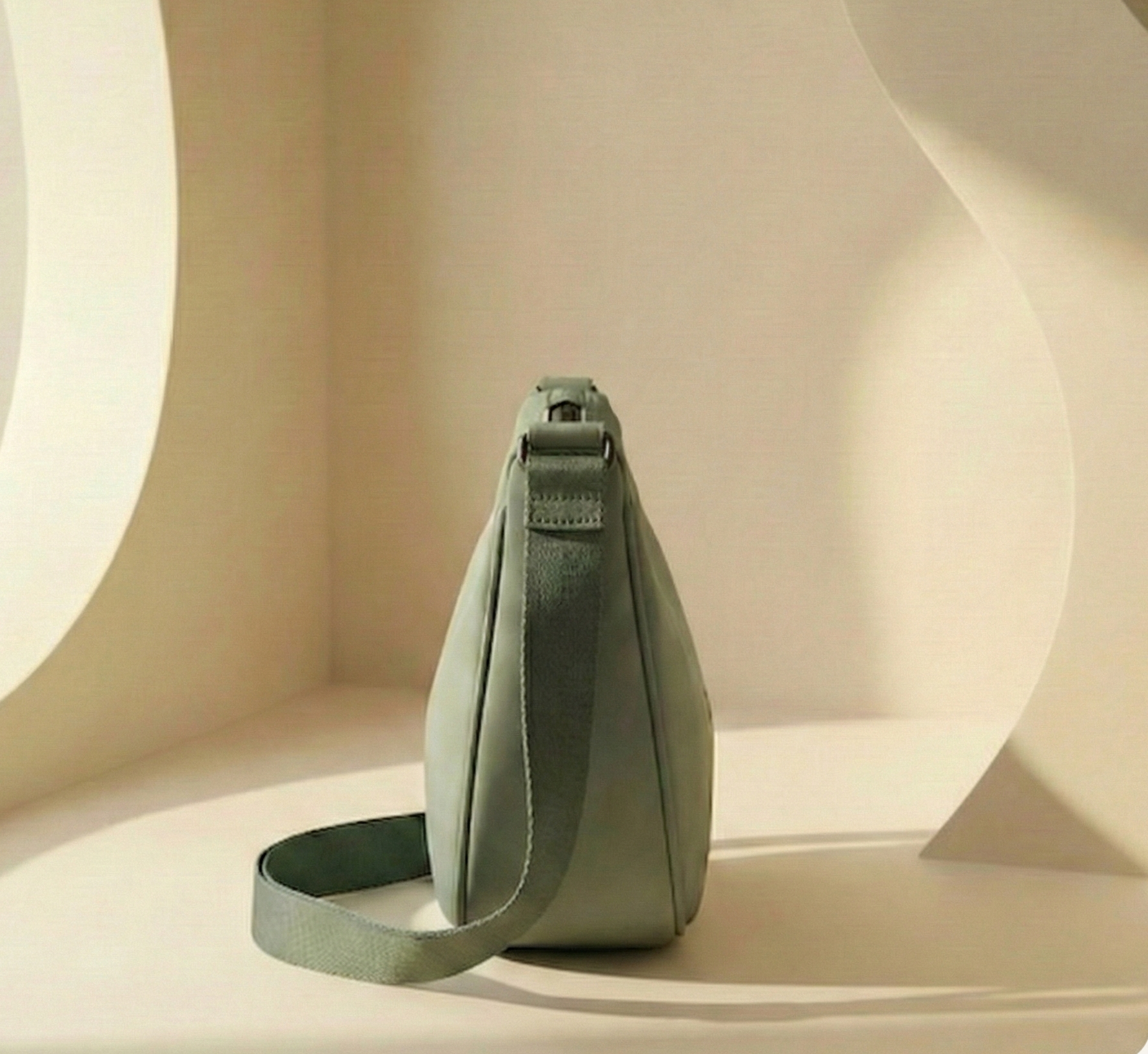 Green shoulder bag on a beige background